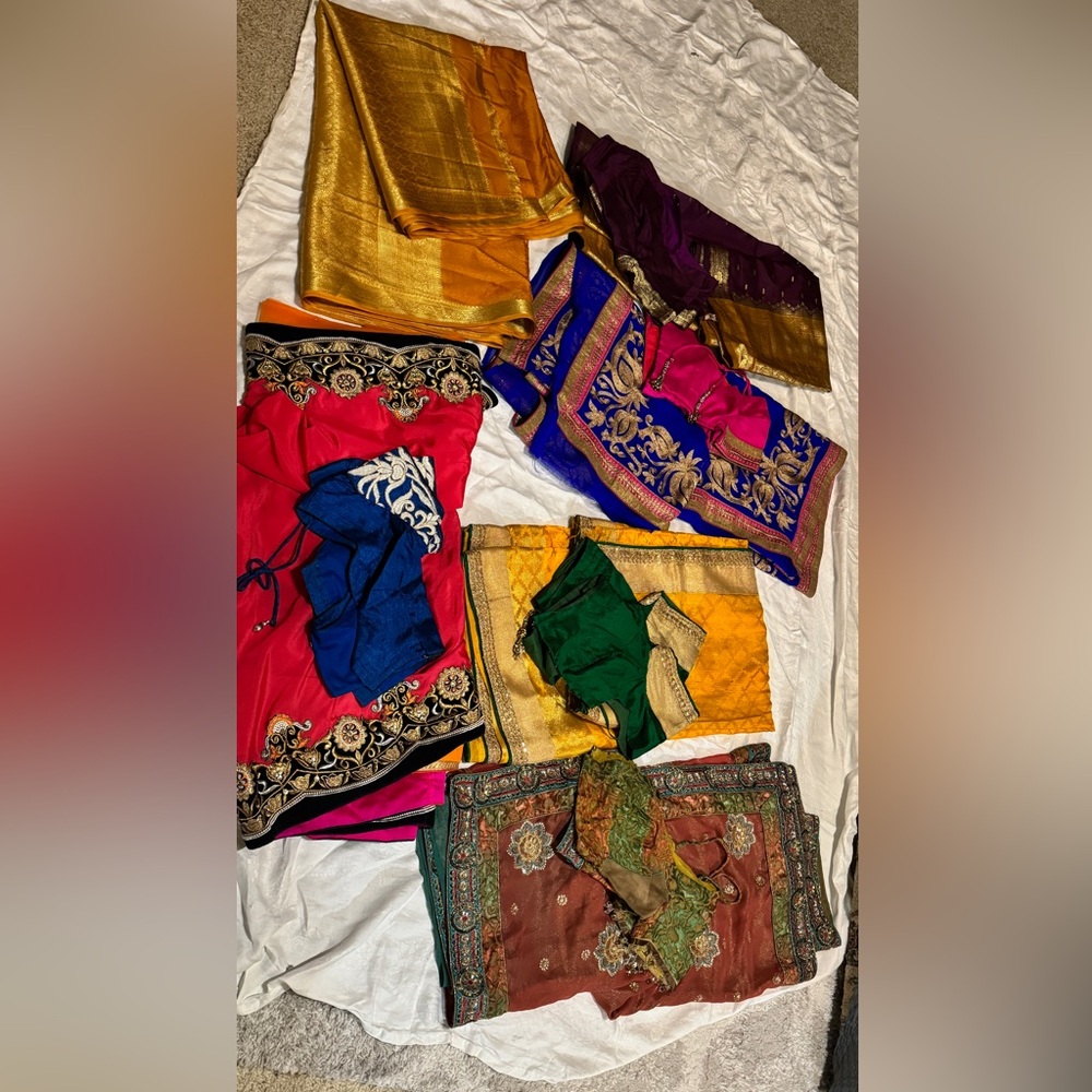 6 beautiful saris with blouses. Only one doesn’t have blouse. V